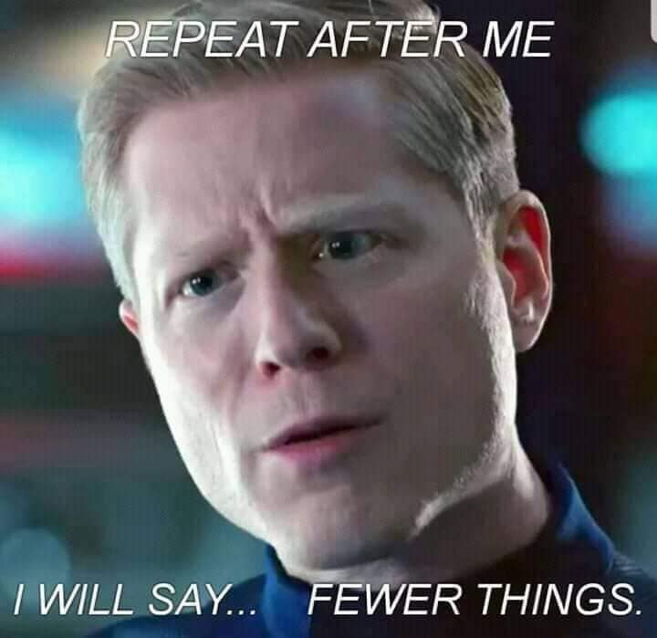 This meme is a photo of a character from a TV show, specifically Captain Sorenson from the TV show "Stargate SG-1". The text on the meme reads: "Repeat after me: I will say less. I will say less." The meme is a humorous way to poke fun at the idea of repeating phrases, with the character's serious expression adding to the comedic effect.